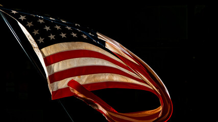 Waving American Flag on Black Background. Lots of Copy Space.