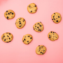 Cookies with chocolate on a pink background. Sweet background.
