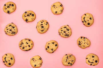 Cookies with chocolate on a pink background. Sweet background.