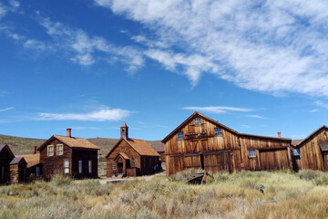 Empty streets of the abandoned ghost town of Bodie in California, USA in the middle of the day.