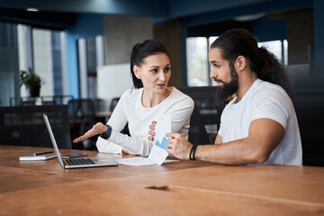 Woman explaining something to her colleague