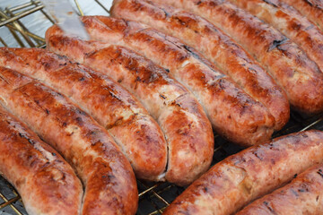 hot sausages on a grill