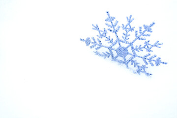 Snowflake in the snow. Christmas snow background. Christmas background with empty field for text.