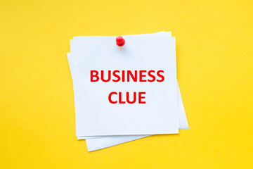 word business clue on white sticker with yellow background