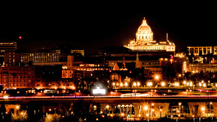 Fototapeta na wymiar Panorama of St. Paul, Minnesota at night, including the State Capitol building 