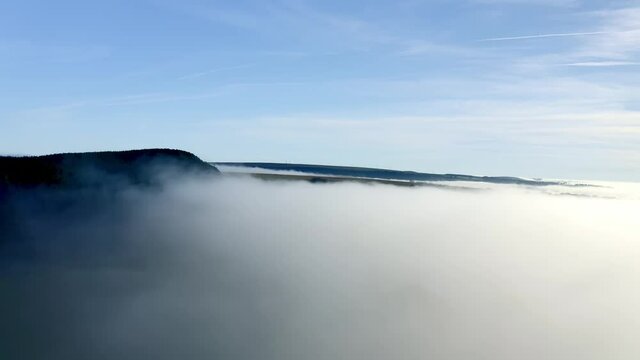Stunning Drone footage flying ontop of cloud of fog in the welsh valleys south wales uk.