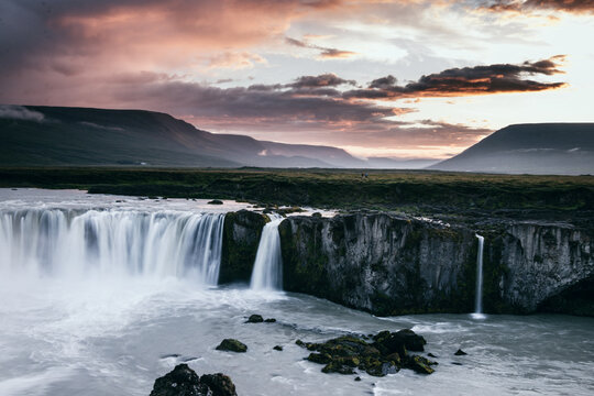 This picture shows the Godafoss in Iceland while a nice sunset takes place. You will enjoy the clear look at the icelandic moody region. The long-exposure of the waterfall  gives it a nice look.