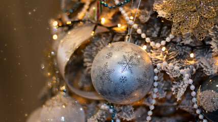 Christmas festive background, fir tree with bokeh lights and new year balls. Festive New Year background.