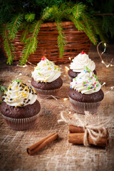 Cake chocolate muffins and cinnamon on christmas table