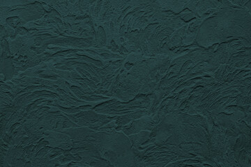 Luxurious backdrop of Venetian stucco in trendy color of 2021 Tidewater Green. Handwork. Texture of plastered wall with glaze finish.