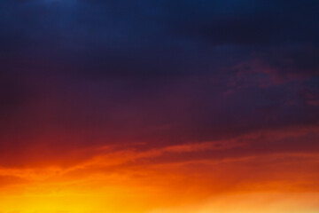 Naklejka na ściany i meble Dramatic field during sunset before a thunderstorm, nature background.