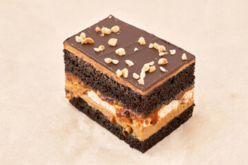 Dark biscuit cake with cream interlayer and chocolate fondant