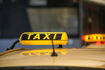 Close-up of taxi sign on yellow car