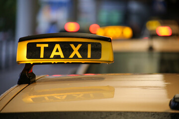 Close-up of taxi sign on yellow car