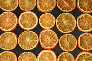 Fototapeta premium Background from slices of orange fruit.