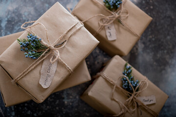 Fototapeta na wymiar Zero waste gift boxes. Eco-friendly gift wrapping in kraft paper.minimalist style of gift wrapping. top view