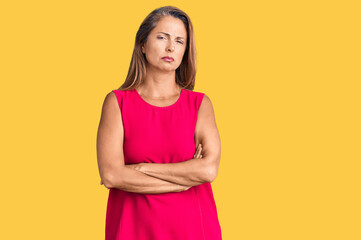 Middle age hispanic woman wearing casual clothes skeptic and nervous, disapproving expression on...