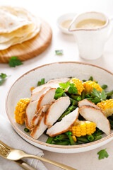 Chicken salad with corncobs and green beans