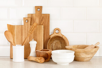 Kitchen utensils on countertop, culinary background, wooden and white ceramic kitchenware, home cooking concept