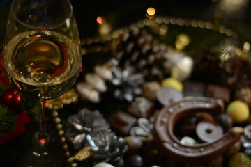 New Year's still life with champagne and sweets
