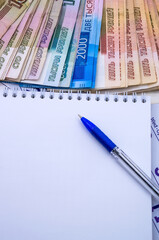 Stationery and money. Ruble bills and stationery.