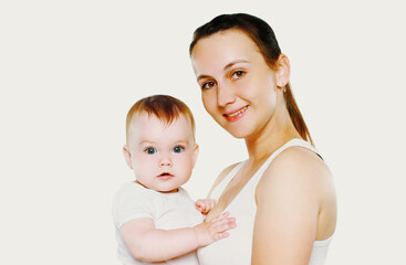 Portrait of happy smiling mother with her cute baby over a white background