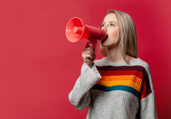 Beautiful blonde in sweater wtih megaphone