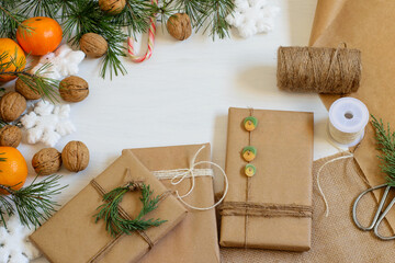 Zero waste gift boxes wrapping brown craft paper, prepared for Christmas. Eco friendly accessories for diy on the home table. Mock up photo.