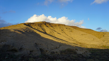 Volcanic mountain, blue sky and clouds in Montaña Pelada, Tenerife, Canary Islands, Spain   