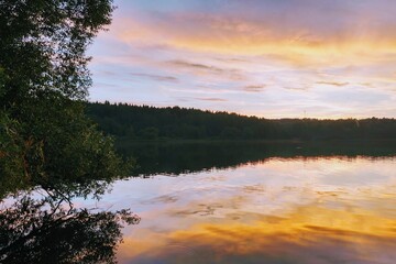 Beautiful sunset on the lake or river. Nature background.