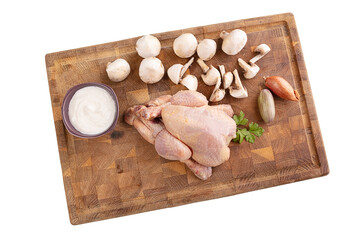 Ingredient for cooking a cockerel on a cutting board