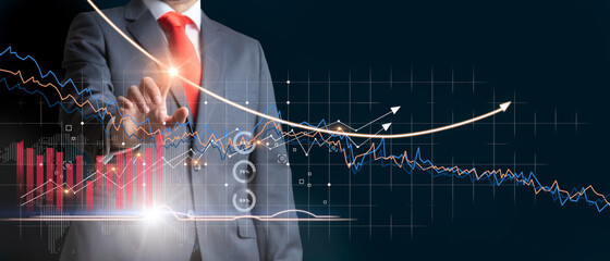 Businessman analyzing the progress of the charts and establishing a business strategy.