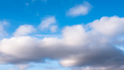 Naklejka na ściany i meble Fluffy white clouds, clouds close-up, sky background