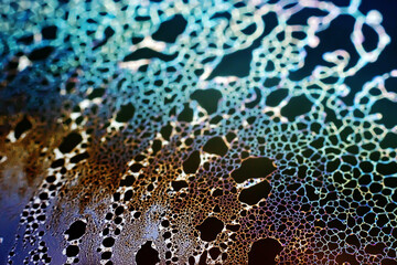 Beautiful psychedelic abstraction formed by light on the surface of a soap bubble