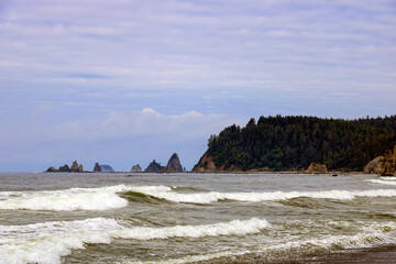 Dramatic rugged coastal seascape on the background of rocks.