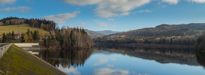 Panoramic view of Zapora Wisla Czarne, water dam in Poland close to city of Wisla, with big accumulation lake behind the dam in late autumn.