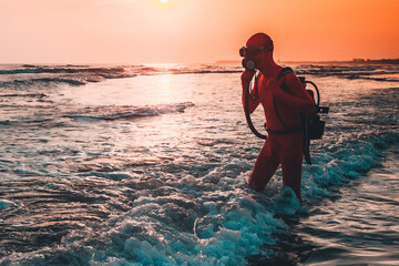 person on the beach at sunset