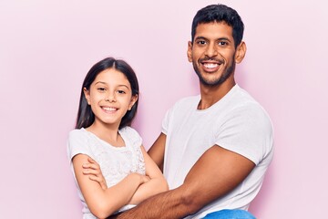 Young father and daughter wearing casual clothes with a happy and cool smile on face. lucky person.