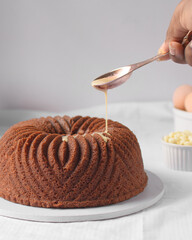 White chocolate bundt cake with a white backdrop