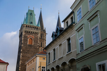 Medieval stone St. Bartholomew´s Church with belfry tower, Gothic Cathedral at the end of narrow street in autumn day, arched windows, Kolin, Central Bohemia, Czech republic