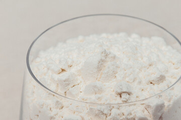 Glass of flour close-up. Macro shot.