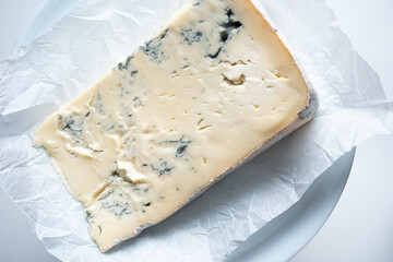 Gorgonzola cheese close up. Typical Italian cheese from the Piedmont region - obrazy, fototapety, plakaty