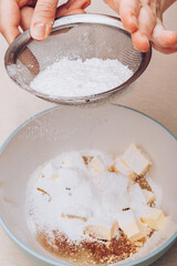 Dough preparation process, mixing of ingredients. Selective focus.
