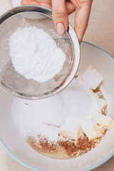 Dough preparation process, mixing of ingredients. Selective focus.