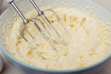 Process of kneading dough using a mixer. Close-up shot.