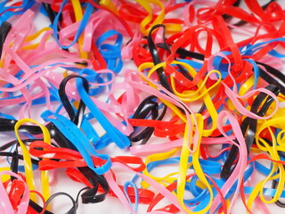 Macro shoot of multi color rubber bands on an isolated background