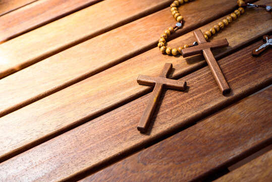 Christian symbols for religious believers, wooden background.