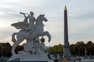 One of the classic sculptures that decorate the Champs Elysees in Paris and in the background you...