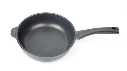 Biack frying pan with non-stick teflon coating on white background