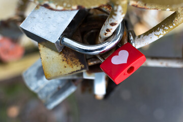 Love metal padlock on the bridge